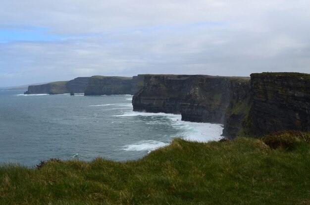 Crashing waves from galway bay onto the cliffs of moher located in Ireland