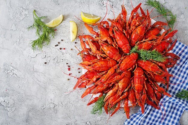 Free photo crayfish. red boiled craw fishes on table in rustic style, closeup.