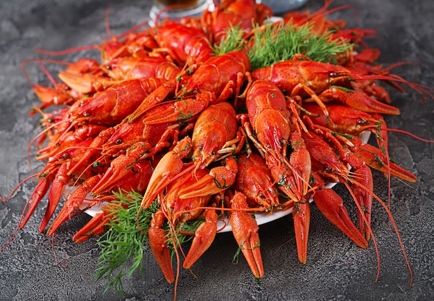 Free photo crayfish. red boiled crawfishes on table in rustic style, closeup. lobster closeup. border design