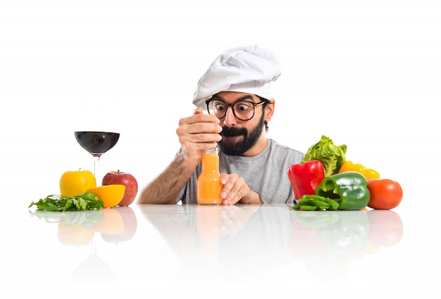 Crazy hipster chef making orange juice