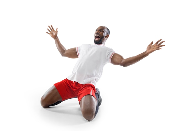 Crazy, mad happiness. Funny emotions of professional football, soccer player isolated on white studio wall.