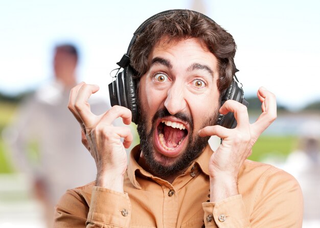 crazy man with headphones.funny expression