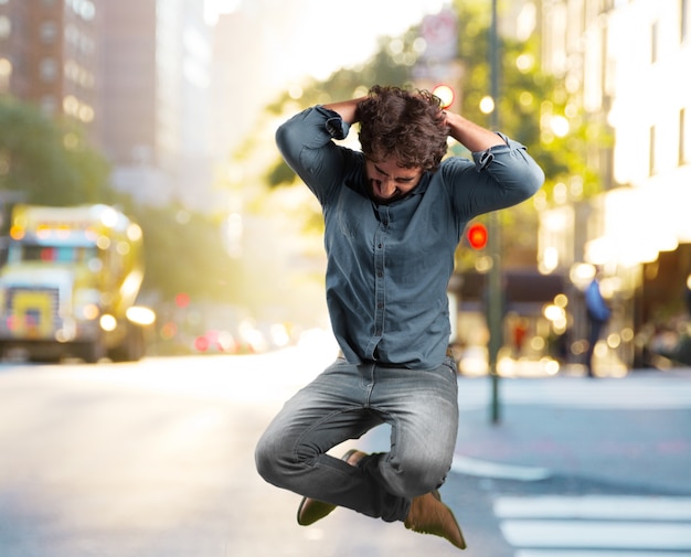 crazy young man jumping. happy expression