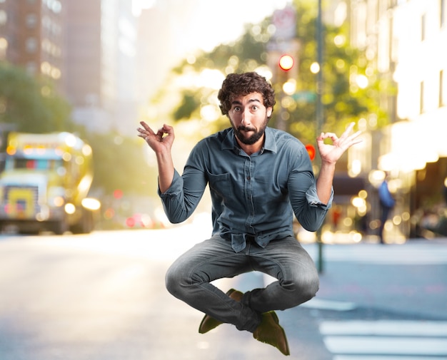 Free photo crazy young man jumping. happy expression