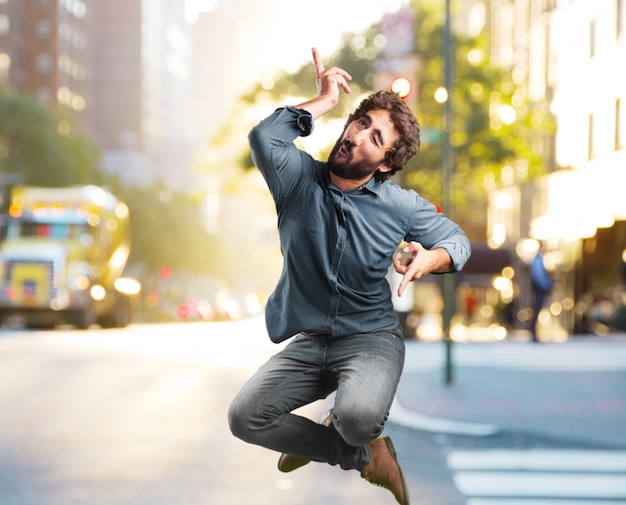 Free photo crazy young man jumping. happy expression