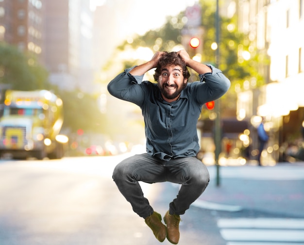 Free Photo crazy young man jumping. happy expression