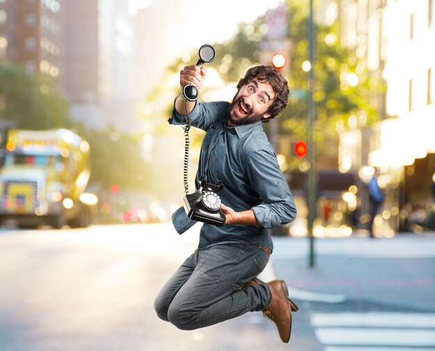 crazy young man jumping. happy expression