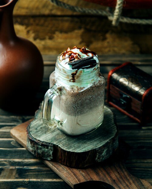 Creamy coffee drink topped with cookie