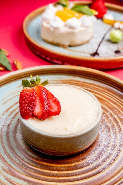 Creamy dessert topped with sliced strawberry