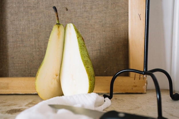 Creative arrangement of pear with candlestick