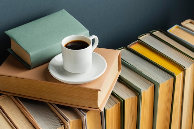 Creative arrangement with different books and coffee