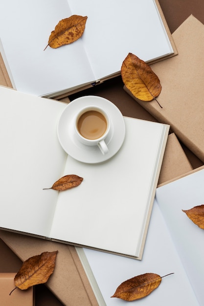 Creative arrangement with different books and a cup of cofee