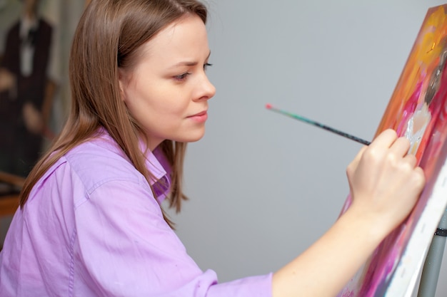 Creative artist painting in the studio