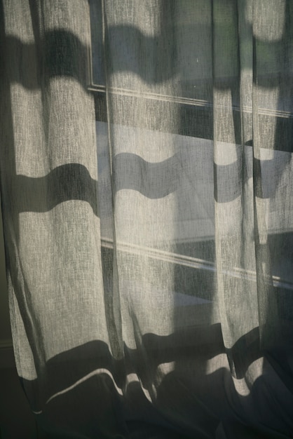 Free Photo creative background with curtain and shadow from window