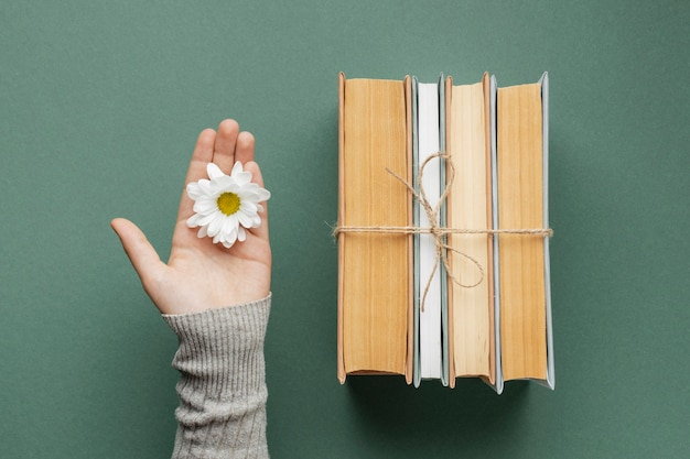 Free Photo creative composition with books and flower