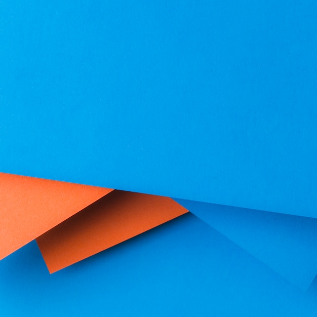 Creative design made with blue and an orange paper