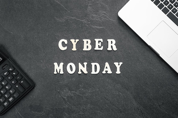 Free photo creative flat lay promotion composition cyber monday text on a black background