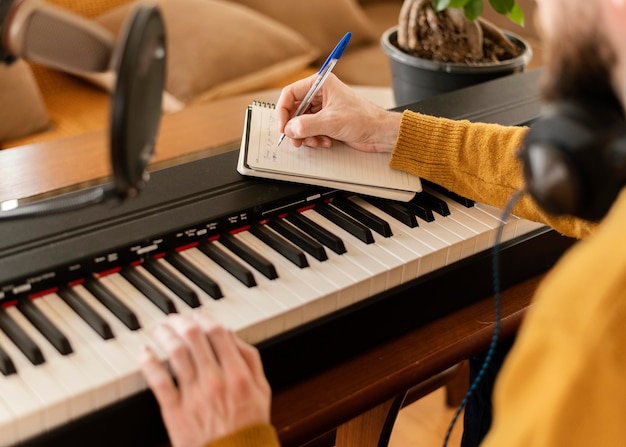 Creative man practicing a song at home