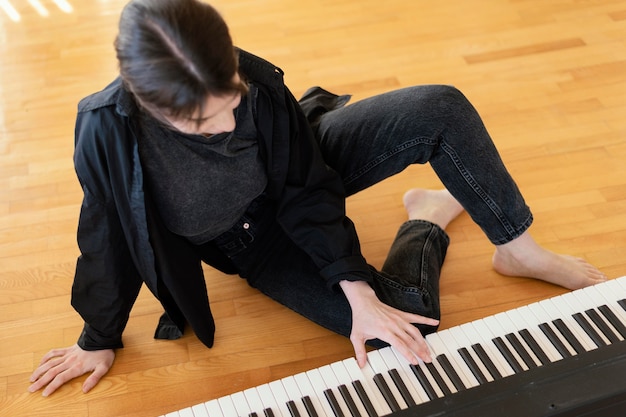 Free photo creative person practicing a song indoors