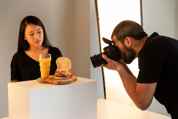 Free photo creative product photographer in studio