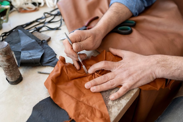 Creative tailor working in workshop