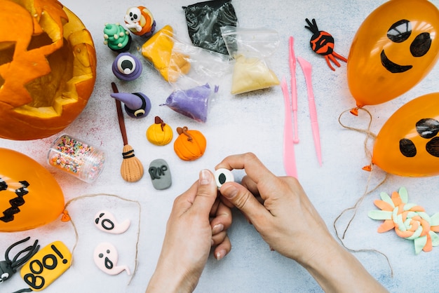 Free photo creative workplace with plasticine and halloween figures