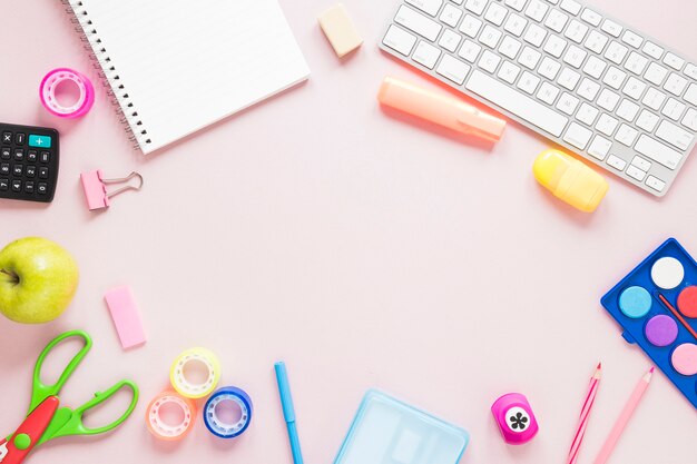 Creative workspace with keyboard and school supplies