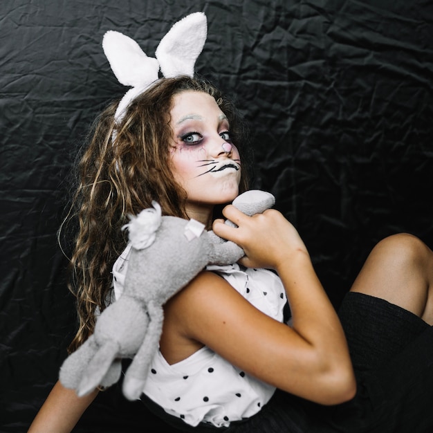 Free photo creepy bunny with rabbit making funny face