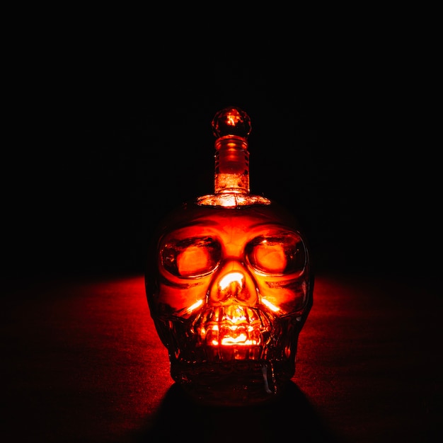 Free photo creepy crystal bottle in dark