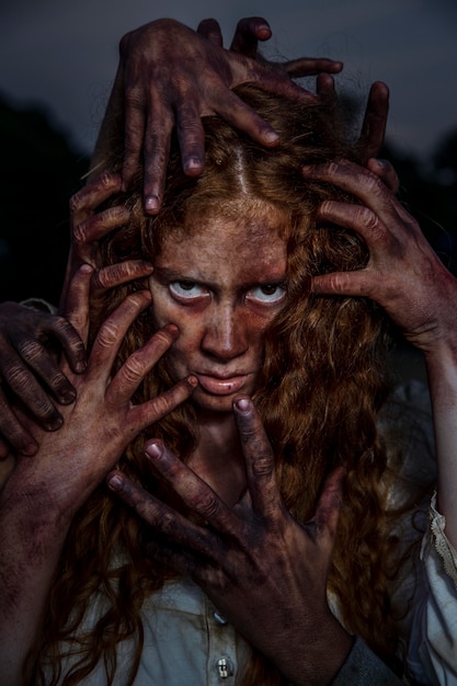 Free photo creepy female zombie outdoors