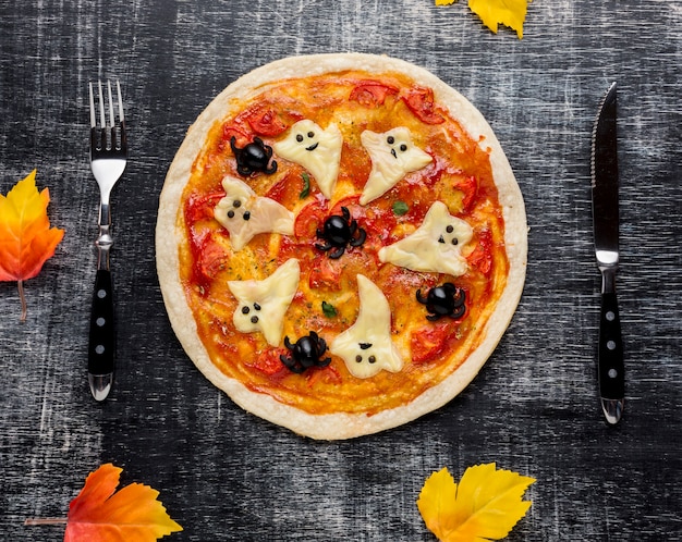 Creepy halloween pizza with cutlery