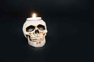 Free photo creepy skull candlestick