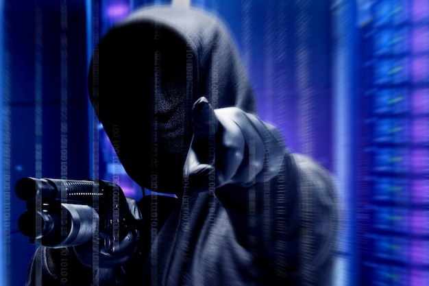 Free Photo a criminal man in a hidden mask hold the shotgun and points something with binary code background