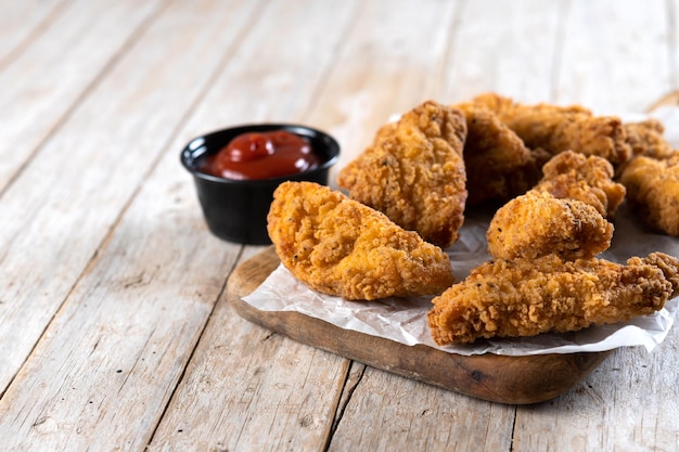 Crispy Kentucky fried chicken on wooden table