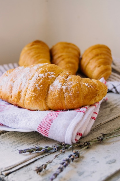 Croissant with branch on table