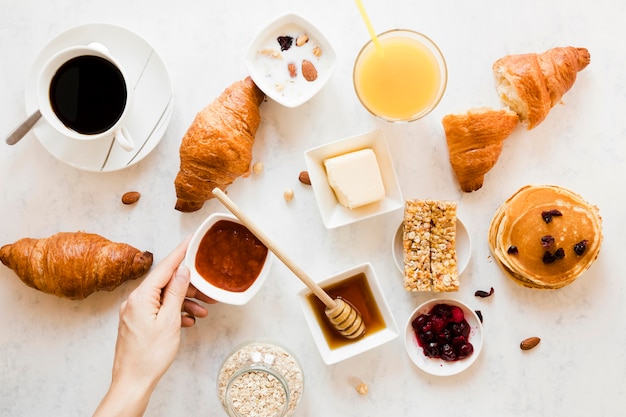 Croissants with jam honey orange juice and coffee