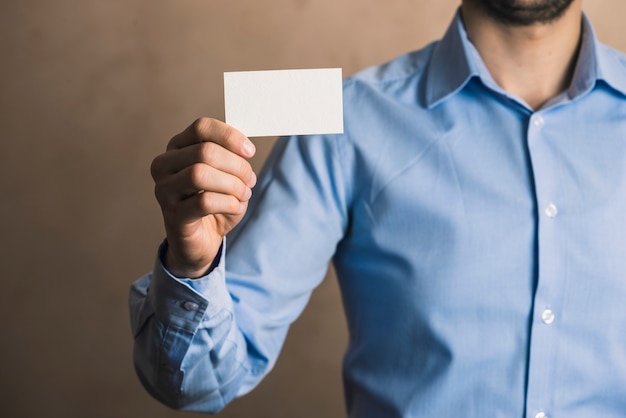 Free photo crop businessman with card