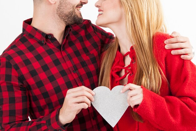 Crop couple with paper heart