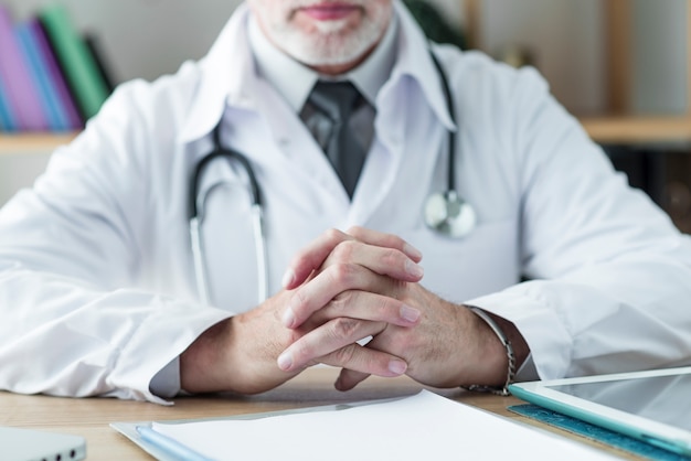 Crop doctor sitting at table