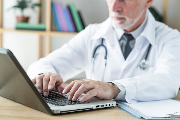 Crop doctor typing on laptop