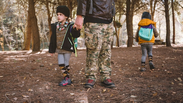 Free photo crop father with children in woods