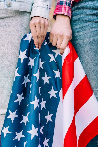 Free photo crop female hands with colorful usa flag