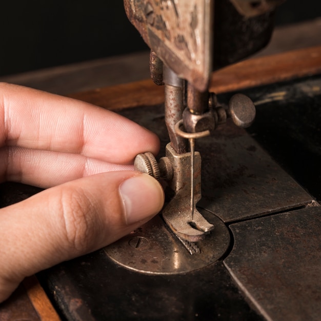 Crop hand adjusting needle on sewing machine