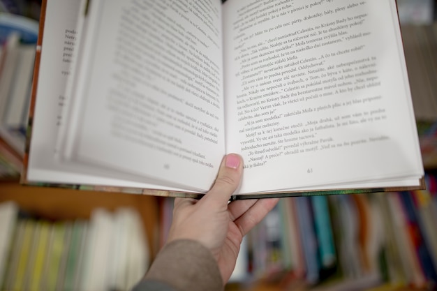 Free Photo crop hand holding book