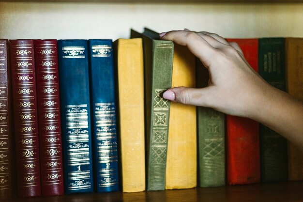 Crop hand taking vintage book