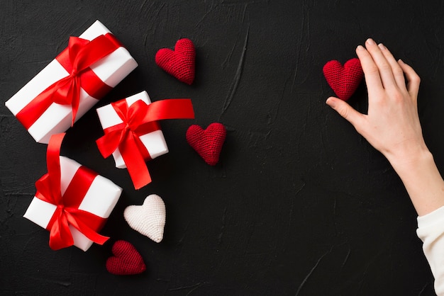 Free Photo crop hand touching heart near presents