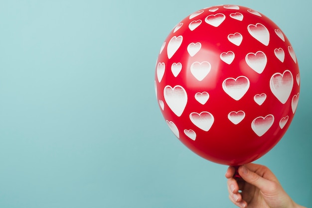 Crop hand with nice balloon