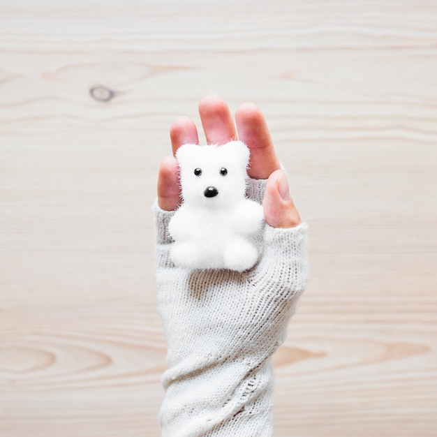 Free Photo crop hand with toy bear