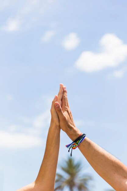 Crop hands of man and woman touching 