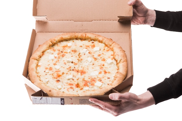 Crop hands showing box with pizza